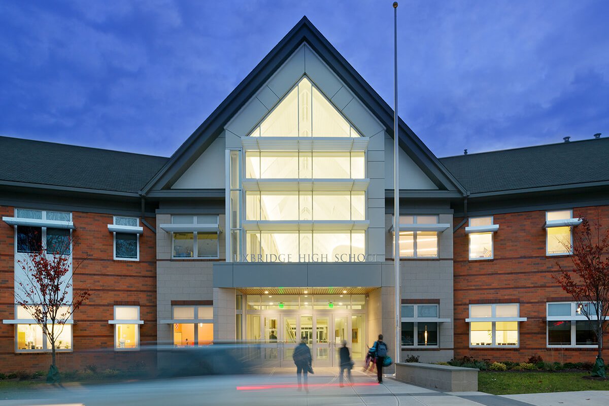 Uxbridge High School front exterior at dusk
